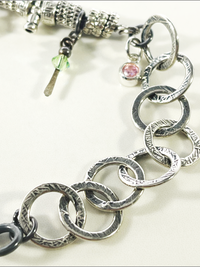 DevaArt Studio: eclectic handmade bracelet: sterling, antique silver, vintage beads, silver charms, Swarovski crystals.