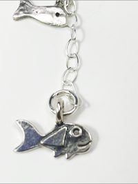 DevaArt Studio Artisan Handmade Jewelry: ocean inspired, sterling, fused glass fish charm necklace.