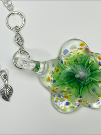 "Flower" is an artisan handmade necklace. Murano glass, sterling silver leaf, sterling silver 24" oval chain.