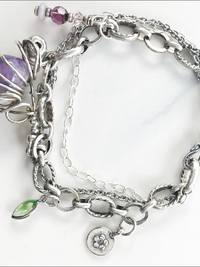 Eclectic handmade bracelet: vintage amethyst stone, Swarovski crystals, sterling silver beads.