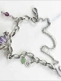 Eclectic handmade bracelet, vintage amethyst stone, Swarovski crystals, sterling silver beads. 
