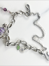 Eclectic handmade bracelet, vintage amethyst stone, Swarovski crystals, sterling silver beads.