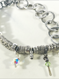 DevaArt Studio: eclectic handmade bracelet: sterling, antique silver, vintage beads, silver charms, Swarovski crystals.