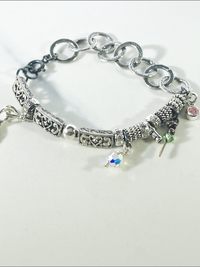 DevaArt Studio: eclectic handmade bracelet: sterling, antique silver, vintage beads, silver charms, Swarovski crystals.