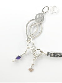 "Lola" - eclectic bracelet; sterling silver, amethyst crystals, hammered, antique silver, vintage beads, Swarovski crystals.