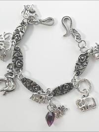 DevaArt Studio: eclectic bracelet; antique silver elephant charms, pewter, stainless steel, crystals.