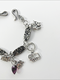 DevaArt Studio: eclectic bracelet; antique silver elephant charms, pewter, stainless steel, crystals.