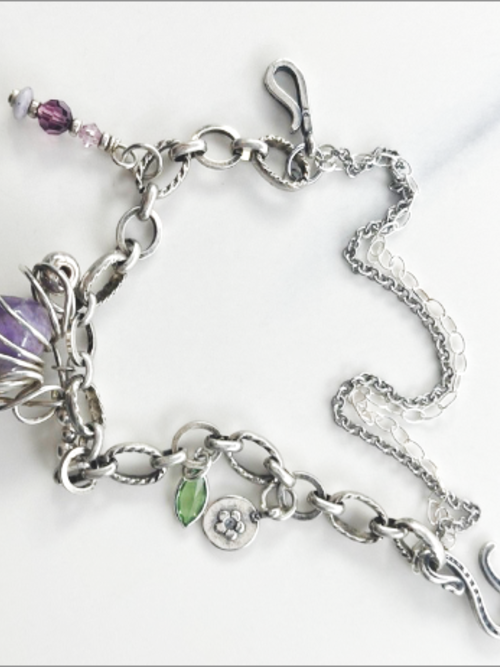 Eclectic handmade bracelet, vintage amethyst stone, Swarovski crystals, sterling silver beads. 