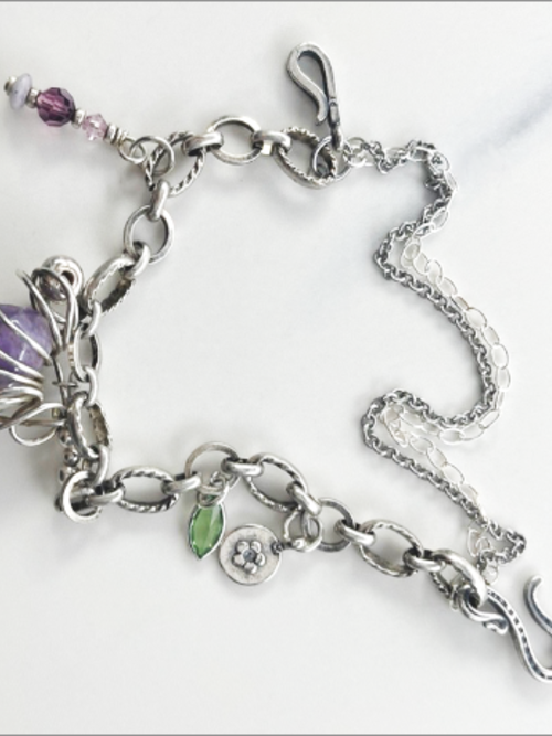 Eclectic handmade bracelet, vintage amethyst stone, Swarovski crystals, sterling silver beads.