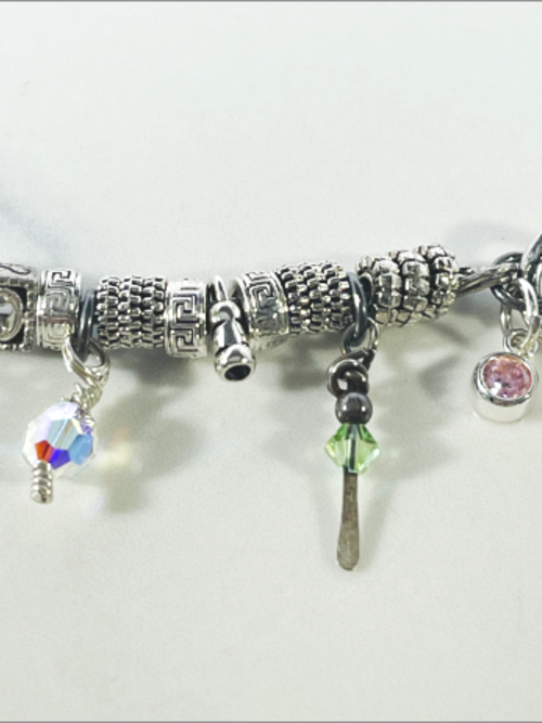 DevaArt Studio: eclectic handmade bracelet: sterling, antique silver, vintage beads, silver charms, Swarovski crystals.