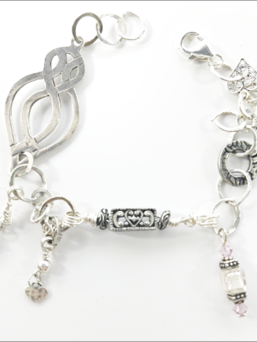 "Lola" - eclectic bracelet; sterling silver, amethyst crystals, hammered, antique silver, vintage beads, Swarovski crystals.