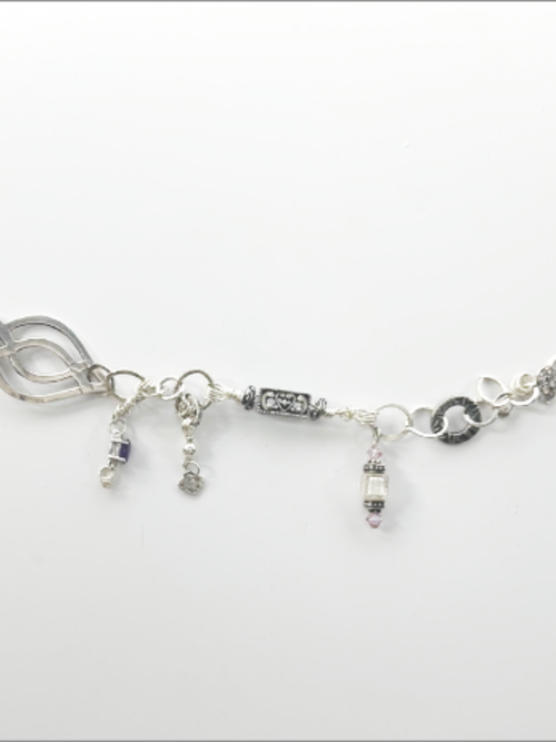 "Lola" - eclectic bracelet; sterling silver, amethyst crystals, hammered, antique silver, vintage beads, Swarovski crystals.