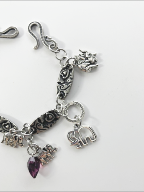 DevaArt Studio: eclectic bracelet; antique silver elephant charms, pewter, stainless steel, crystals.