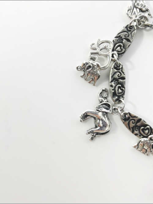 DevaArt Studio: eclectic bracelet; antique silver elephant charms, pewter, stainless steel, crystals.