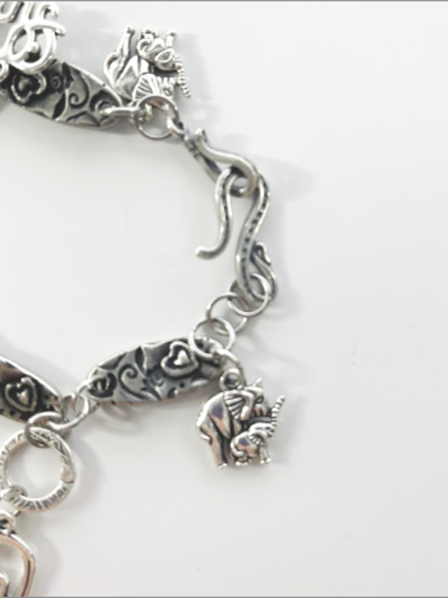 DevaArt Studio: eclectic bracelet; antique silver elephant charms, pewter, stainless steel, crystals.