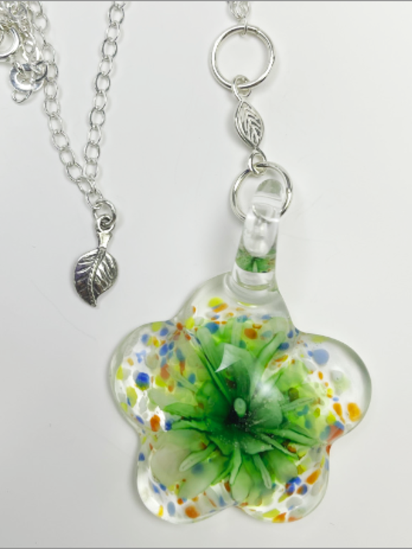 "Flower" is an artisan handmade necklace. Murano glass, sterling silver leaf, sterling silver 24" oval chain.