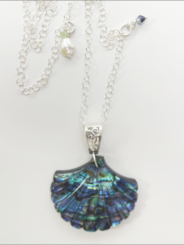 Ocean inspired sterling silver Pava scallop sea shell charm necklace.